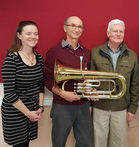 (from left) Donna Dupuy (concert band conductor); holding euphonium, Randy Kligerman (president, NHB Toronto); Bill Condon, who gifted the euphonium