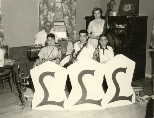 LaBarbera family band, circa 1955. Joseph at the keyboard, Josephine on bass, with Joe, Pat, and John in the frontline. “My mother learned bass because she felt left out of family events. She learned by putting a fingering chart above the kitchen sink and memorized the fingerings as she did the dishes. It was very unusual for a woman to be playing bass but my mother was ahead of her time and very independent before she met my father.”