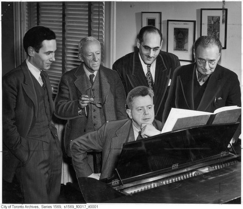 Ernest MacMillan at the piano with (left to right) Godfrey Ridout, Leo Smith, John Weinzweig and Healey Willan surrounding him, circa 1948. Photo credit NOTT AND MELL (CITY OF TORONTO ARCHIVES)