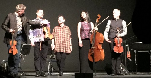 Laurie Anderson amidst the Kronos Quartet in Chicago after performing Landfall (2015)