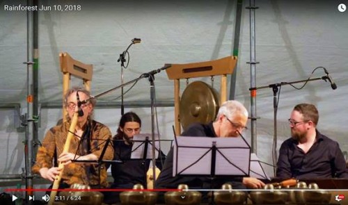 Andrew Timar (left) plays suling gambuh with members of Evergreen Club Contemporary Gamelan at International Gamelan Festival, Munich, Germany 2018. The screenshot is from the Rainforest video on ECCG’s YouTube channel.