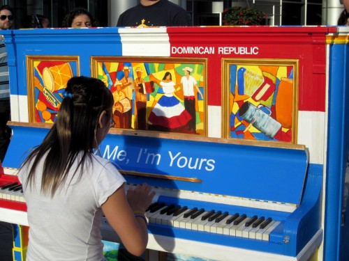 July 2012: Toronto’s Play Me I’m Yours installation, inspired by Luke Jerram, was the brainchild of the creative arts director for the 2015 Pan Am games, Don Shipley. 41 street pianos, each decorated to reflect a country participating in the games, were unleashed in places like Pearson airport, Union Station, on the Toronto Island Ferry and city parks, squares and streets. Photo credit THEKATANDTHEFALLINGLEAVES