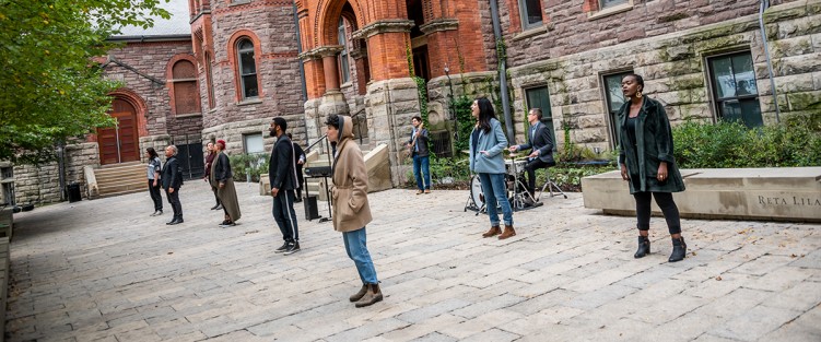 The UnCovered: Notes from the Heart ensemble, recording the full cast finale in front of Koerner Hall, Royal Conservatory of Music. Photo by Dahlia Katz