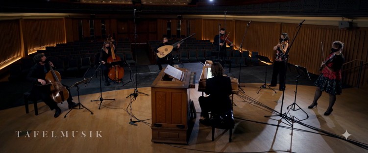 Still from Tafelmusik’s Il Seicento, February 18. L-R: Keiran Campbell (cello), Pippa Macmillan (violone), Lucas Harris (theorbo and guitar), Brandon Chui (viola), Elisa Citterio (violin), Patricia Ahern (violin) and Christopher Bagan (harpsichord and organ).