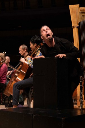 Trevor Copp miming Le Carnaval des animaux with orchestra at Festival of the Sound in Parry Sound, Ontario. Photo credit: Mark Rash.