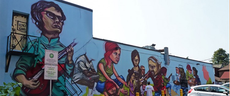 Tranzac, n. exterior:  “another of our assets, our onsite parking lot ...”  Mural by Elicser, photo by RedPat