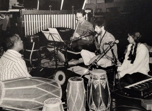 Members of Nada Rasa ensemble at Gamelan Summit 1997, DuMaurier Theatre, Harbourfront Centre, Toronto. Left to Right: Trichy Sankaran (mridangam, kendangs), Andrew Timar (suling tembang), Ernie Tollar (sop. sax), Suba Sankaran (vocals, keyboard).