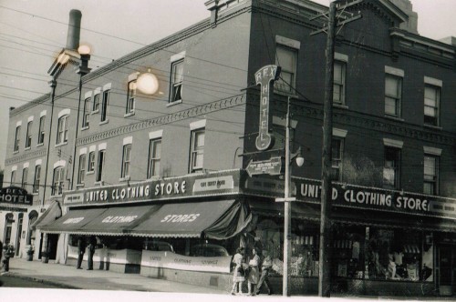 The United Clothing Store, with a side entrance for the Rex Hotel (1950s).