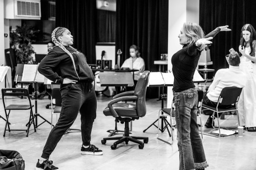 Taking a moment to stretch on the first day of music rehearsals: Divine Brown (Hélène) & Donna Garner (ensemble); to their right: Hailey Gillis (Natasha) & Marcus Nance (Andrei). Photo by Dahlia Katz.