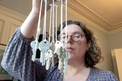 Emily Doolittle with a key chime created for her composition (re)cycling I: metals. Photo courtesy of Emily.