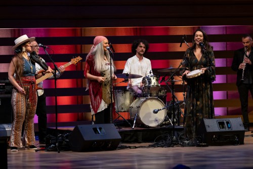 KUNÉ with Maryem Toller (centre).  A “global orchestra”  founded by Mehta to showcase Toronto’s musical and cultural diversity. “KUNÉ is probably the thing I’m proudest of. It showed what’s possible when musicians from around the world come together with openness, flexibility, and curiosity — and when a city hears itself reflected on stage.” Credit: Royal Conservatory of Music | Lisa Sakulensky 